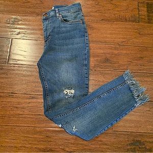 Free People Ankle Length Jeans with Slanted Fringed Hemline